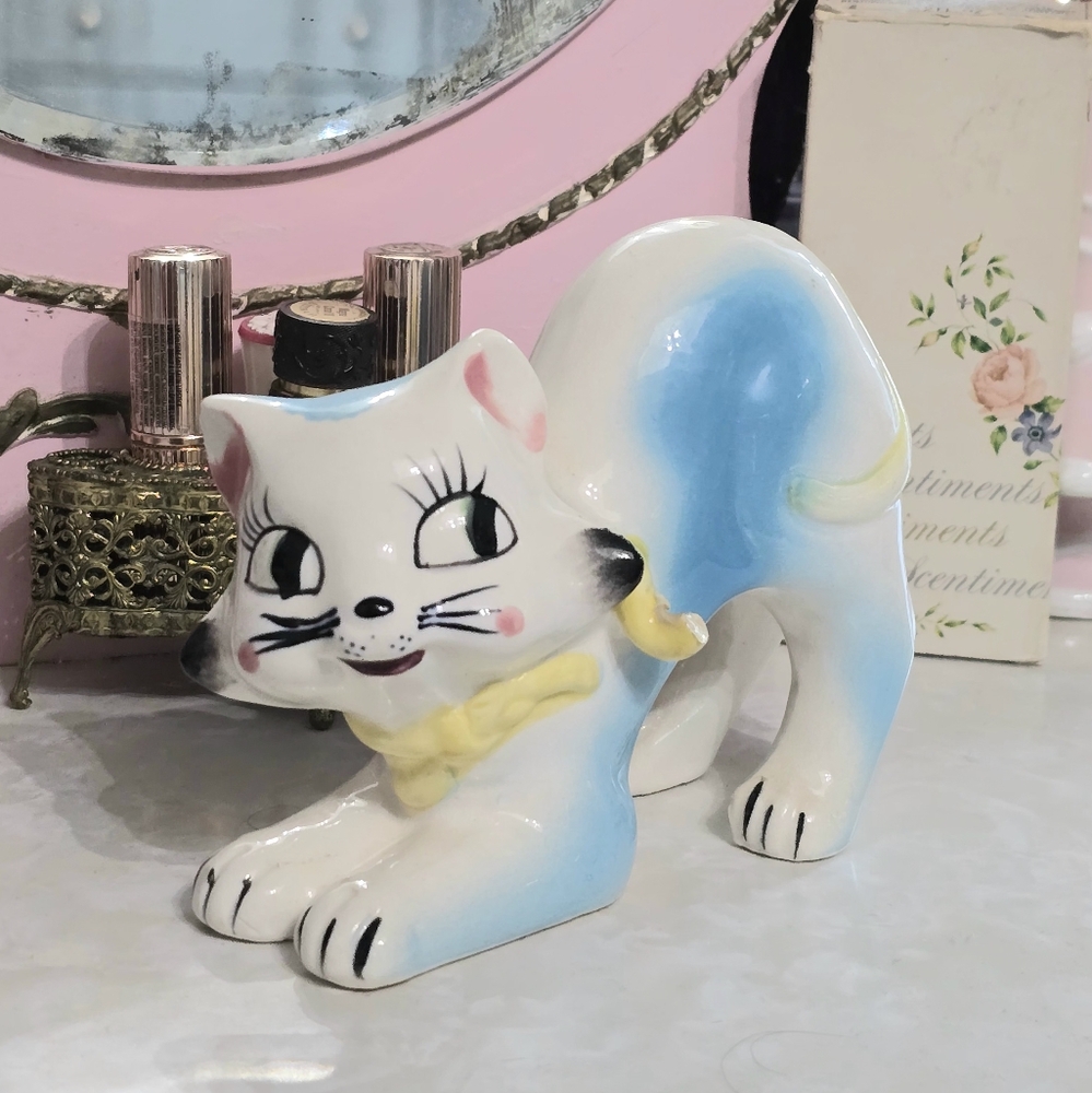 Playful Blue and White Ceramic Cat Figurine